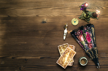 Tarot cards on wooden table. Fortune teller table..