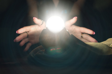 Crystal ball and fortune teller hands. Divination. Seance.