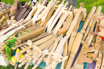 photo wooden toys swords, sticks, vending machines, baseball bats lie on the counter for sale