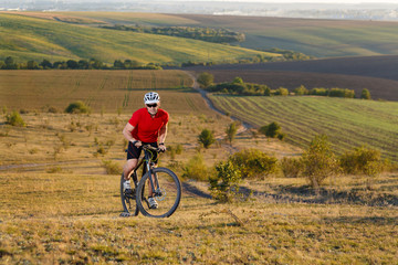 Fototapeta na wymiar Traveler ride a bike on autumn background