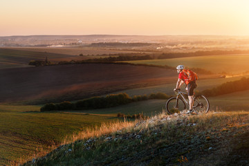 Fototapeta na wymiar Traveler ride a bike on autumn background