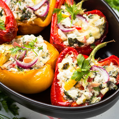 Stuffed paprika peppers with cheese and herbs. Close up.