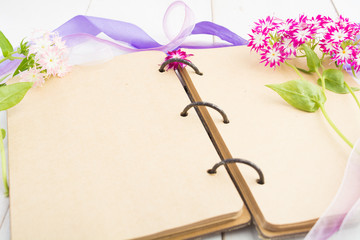 Handmade vintage notebook with flowers and ribbons