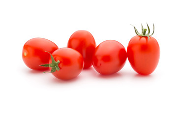 Small plum tomatoes on a white background.