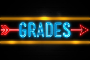 Grades  - fluorescent Neon Sign on brickwall Front view