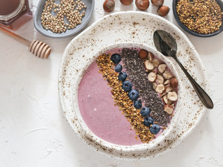Healthy breakfast. Buckwheat Porridge. Raw buckwheat vegan breakfast smoothie bowl with fresh blueberries, nuts, chia seeds and bee pollen. Clean eating, dieting, detox, vegetarian food concept