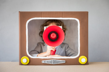 Child playing with cartoon TV