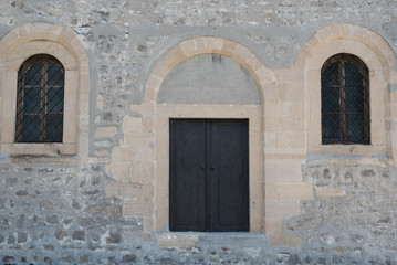 Fototapeta na wymiar old stones wall with the door