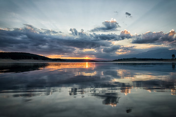 beautiful sunset over a dam