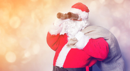Funny Santa Claus have a fun with binoculars