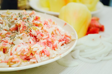 Raw minced meat with rice and spices, fresh vegetables. Ingredients for home cooking.