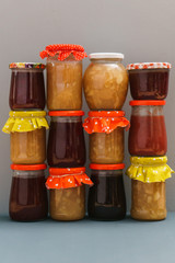 Different jams freshmade by traditional recipe on a grey background 