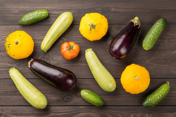Vegetarian healthy food with vegetables. Tomato, cucumbers, bush pumpkins, eggplants nd marrows on...