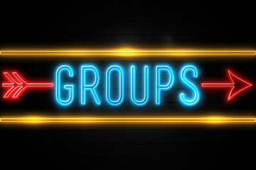 Obraz premium Groups - fluorescent Neon Sign on brickwall Front view