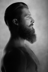 Black and white side view portrait of bearded man