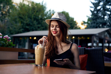 1397929 Woman in a hat on the street in a cafe