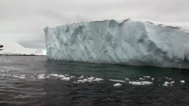 Ice movement icebergs of global warming floats in ocean of Antarctica. Amazing unique beautiful wilderness nature and landscape of snowy mountains. Extreme tourism cold desert north pole.