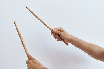 Fototapeta premium The hands hold the drumsticks