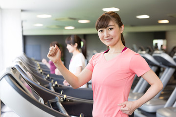 sporty asian women exercising in sports gym