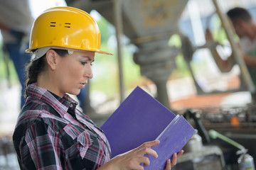 female worker looking up in warehouse