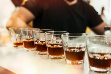 Row of coffee cups made by barista. Coffee tasting concept. Toned image