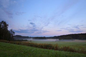 Fototapeta na wymiar Sunrise summer morning at countryside field