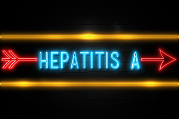 Obraz premium Hepatitis A - fluorescent Neon Sign on brickwall Front view