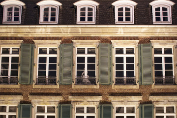 Fototapeta premium Close up view of old, historical building at night in Dusseldorf. Image shows German architectural style.