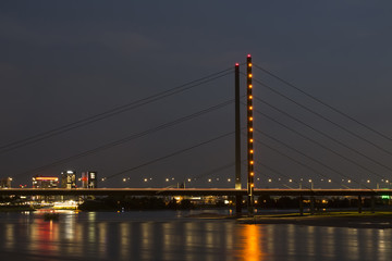 Night view of Rheinkniebrucke bridge and Rhine river. Long exposed image.