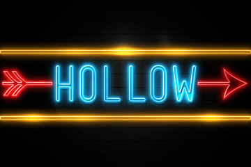 Hollow  - fluorescent Neon Sign on brickwall Front view