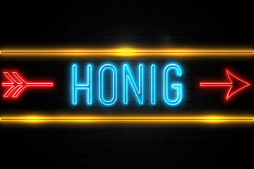 Honig  - fluorescent Neon Sign on brickwall Front view
