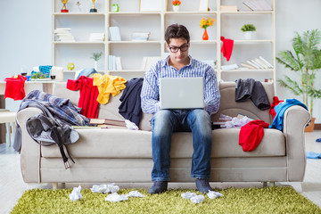 Young man working studying in messy room