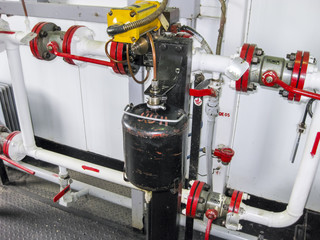 A container for sampling commercial oil at a metering site. Dispensing method of sampling oil with...