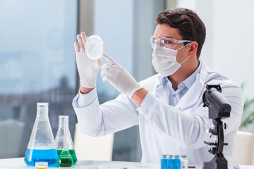 Male doctor working in the lab on virus vaccine