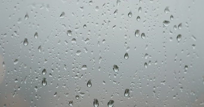 Rain drop on the window in the evening