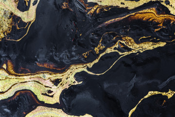 Oil spill texture on the sand beach