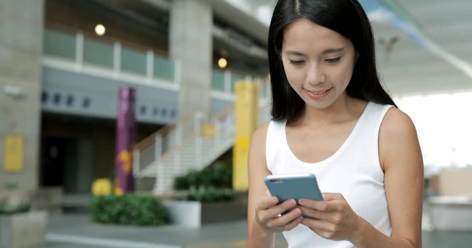 Woman use of mobile phone in university campus