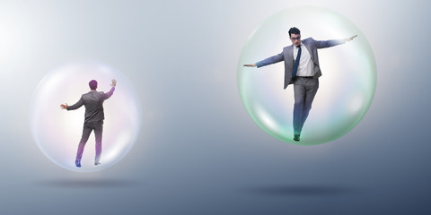 Businessman flying inside the bubble
