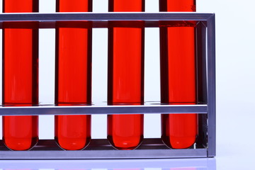 Red Liquid in group of Six Glass Tube Lab Test tools on Stainless stand holder