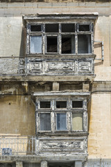 Fototapeta na wymiar Damaged traditional maltese balcony