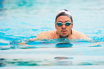 Fototapeta na wymiar 1407925 Portrait of swimming sportsman