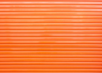 An orange metal door