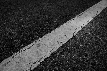 Fototapeta premium Line white old on asphalt black texture background.