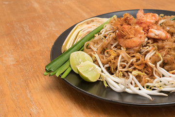 Close up plate of Padthai, Thai noodle with fried shrimp and vegetable,Thai Food, Thailand's national dishes.