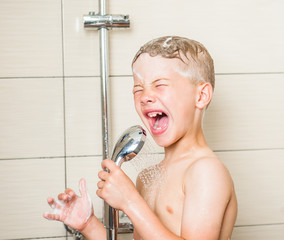Young boy singing in the shower