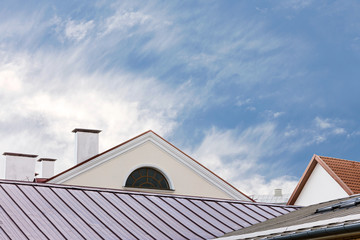 wet metal roofs of old city houses after rain