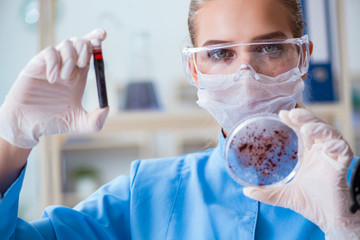 Female scientist researcher conducting an experiment in a labora