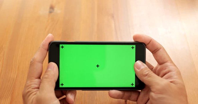Playing game on cellphone with chroma key screen