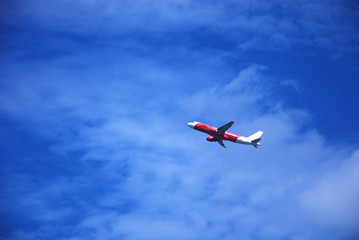 Fototapeta na wymiar plane take off with blue sky background
