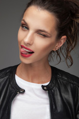 woman sticking out tongue and winks